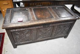 A period oak chest having triple carved panel, dimensions approx. W135 H65 D58cm