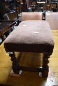 A vintage footstool on barley twist frame