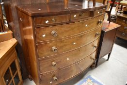 A 19th Century mahogany bow fronted chest having three small drawers over one deep (having faux
