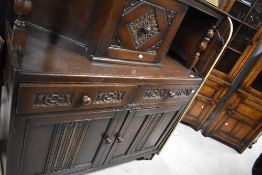 A vintage oak priory style court cupboard, dimensions H138 W121 D46cm