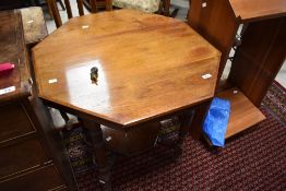 A Victorian mahogany occasional table having octagonal top and undertier, with turned legs, width