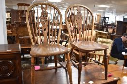 A pair of traditional ash wheelback kitchen dining chairs
