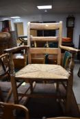 A pair of 19th Century rush seated kitchen chairs