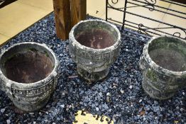 Three concrete planters of classical form