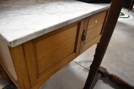 A Victorian wash stand having tile back and marble top, width approx. 99cm