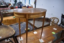 An Edwardian style occasional top having oval top and square tapered legs, width approx. 59cm