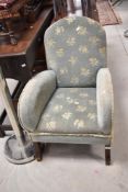 A vintage low seat upholstered armchair (early to mid 20th Century)
