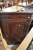 A 19th Century mahogany corner cupboard