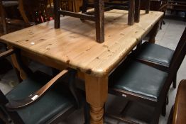 A traditional pine farmhouse style kitchen table having drawer to end, on turned legs, approx. 153 x