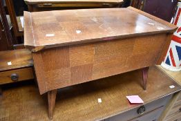A vintage oak and ply sewing table on stylised legs, width approx. 66cm