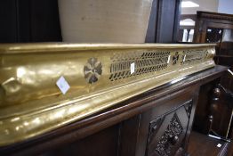 A Victorian brass fire fender, of pierced form, approx. 121 x 31cm