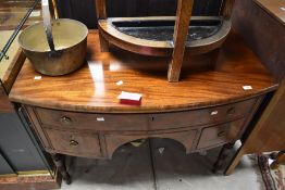 A 19th Century Regency design bow fronted sideboard having long frieze drawer over two deep drawers,