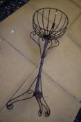 A modern wrought iron torchere