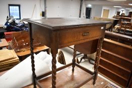 An early 20th Century oak side table having frieze drawer, on twist legs, approx. 68 x 46cm