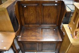 A nice quality reproduction oak box settle of plain panelled form, width approx. 87cm