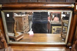 A 19th Century mahogany wall mirror having pillar style surround, approx 86 x 51