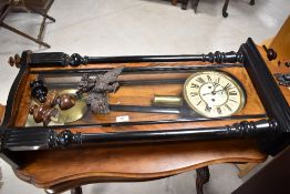 A 19th Century walnut , mahogany and ebonised Vienna style wall clock, having eagle finial and roman