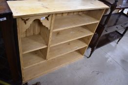 A stripped pine bookshelf, width approx. 109cm