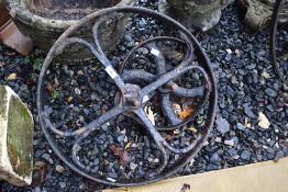Two vintage cast iron barrow wheels