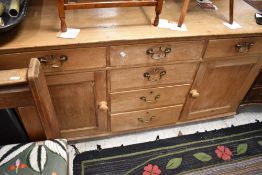 A 19th Century stripped pine dresser base, dimensions approx. W163 H84 D56cm