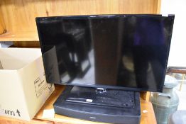 A Samsung 32inch flat screen TV and Bose TV speaker etc