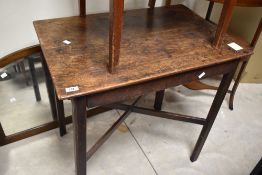A 19th Century oak occasional table having X stretcher, approx. 76 x 50cm, showing some signs of