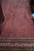 A modern carpet square having red ground in the Oriental style, approx. 300 x 260cm