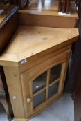 A natural pine glazed corner wall cabinet, height approx. 75cm
