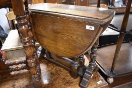 A nice quality reproduction oak (possibly Titchmarsh and Goodwin) fold over occasional table