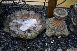 A concrete bird bath