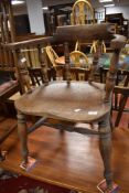 A late 19th or early 20th Century oak captains style chair having turned frame with H stretcher