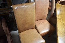 A set of six modern tan leather high back dining chairs
