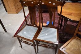 A pair of Art Nouveau stained frame bedroom chairs