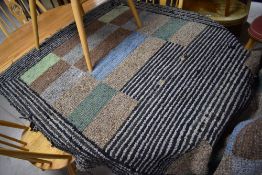 A vintage pegged rag rug