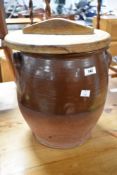 An antique part glazed earthenware egg crock, possibly non matching lid