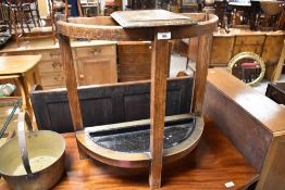 An early 20th Century oak stick stand