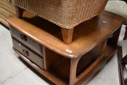 A vintage Ercol , Pandora style coffee table, in mid stain