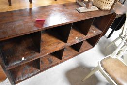 A dark stained pine book/storage shelf , dimensions approx. W152 H80 D35cm