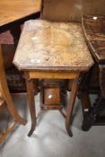 A Victorian satinwood sewing table having faded pokerwork decoration and galleried undertier,
