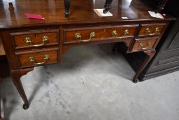 A late 19th/early 2oth century mahogany writing table, by Cooper & Holt (London) the moulded