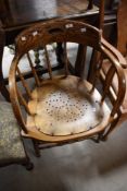 A 19th Century oak captains chair having turned frame
