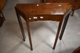 An early 20th Century hall table having canted front, width approx. 73cm