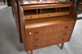 A vintage teak roll top desk , having pull out desk section, dimensions approx. H97 W92 D45cm