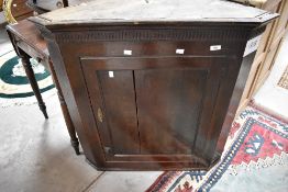 A 19th Century oak corner cupboard