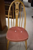A set of six (four plus two) Ercol swan back dining chairs