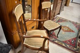 A pair of Art Nouveau mahogany salon or dining chairs (one being a carver chair) having inlaid