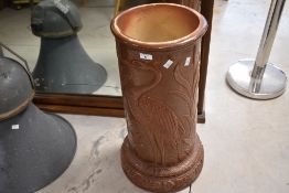 A glazed planter or stick stand in the Bretby style, having crane decoration, height including