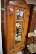 A late Victorian mirror door wardrobe having drawer base, dimensions approx. H202 W85 D37cm