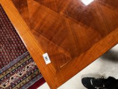 A vintage French cherry/walnut wood dining table, having diamond pattern to top , approx. 167 x