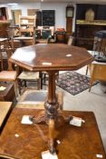 A 19th Century walnut occasional table having octagonal top, diameter approx. 43cm
